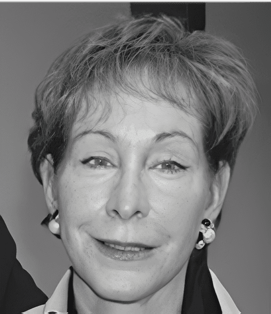 Black-and-white close-up portrait of smiling woman