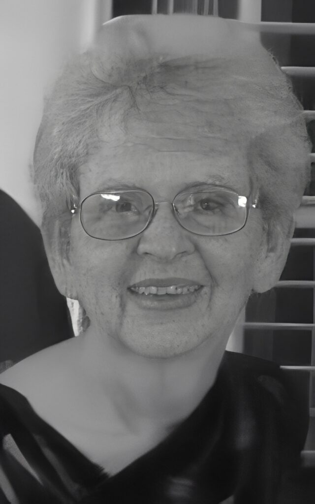 Smiling elderly woman wearing glasses