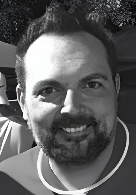 Smiling bearded man portrait in black and white