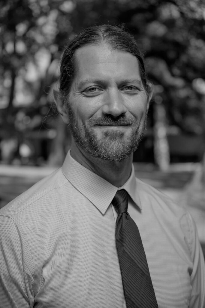 Smiling man outdoors in dress shirt