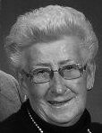 Elderly woman smiling with glasses