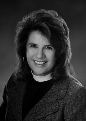Female clergy member smiling