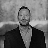Black and white outdoor portrait of man