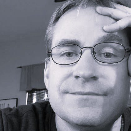 Close-up of man wearing glasses
