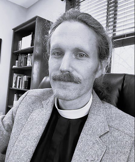 Man with mustache in an office