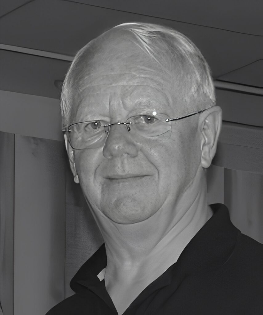 Older man wearing glasses, neutral expression