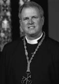 Religious leader in black robe
