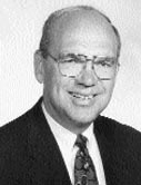 Man wearing glasses and business attire