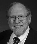 Elderly man in glasses and suit