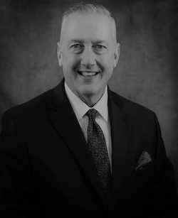 Man in suit smiling confidently
