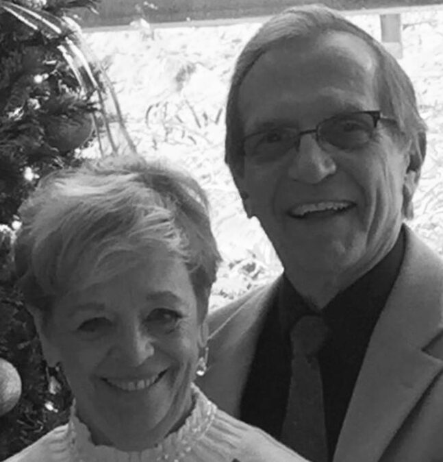 Smiling couple near a Christmas tree