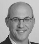 Portrait of a bald man in glasses
