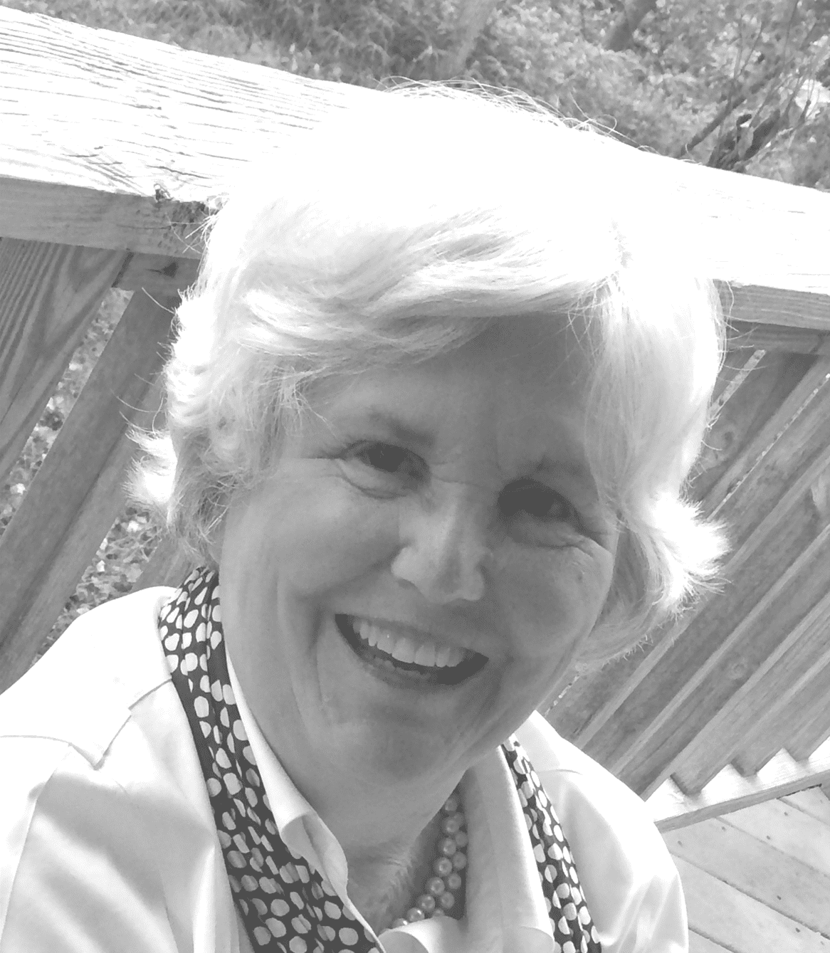 Happy woman sitting outdoors