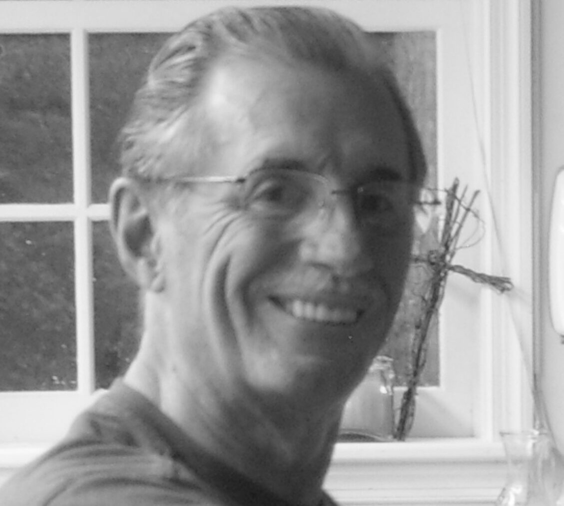 Smiling man near a window