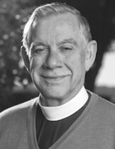 Smiling clergyman wearing clerical collar