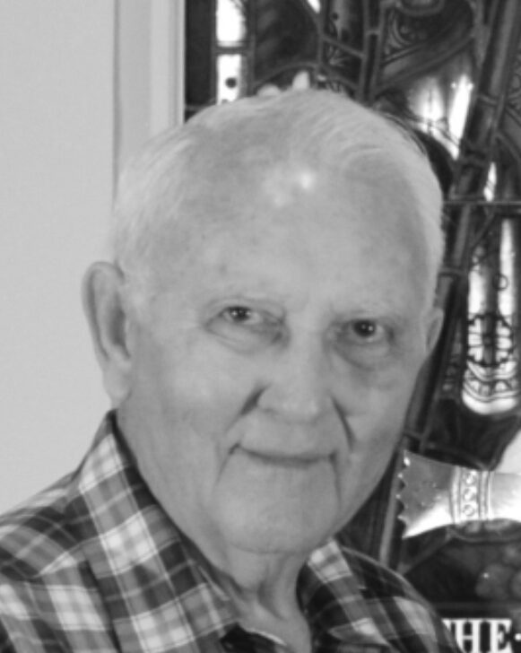 Elderly man smiling in black and white