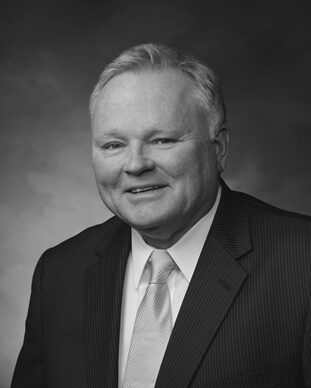 Elderly man in suit, smiling portrait
