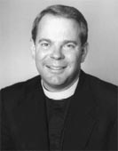Portrait of a man in black suit