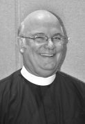 Smiling man in clerical attire