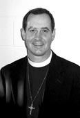 Priest in black and white photo