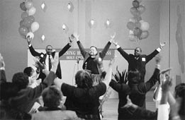 Group raising hands in celebration