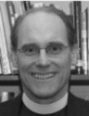 Man smiling in a library