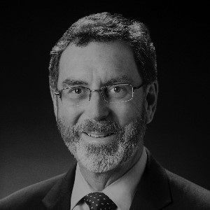 Bearded man with glasses, formal attire