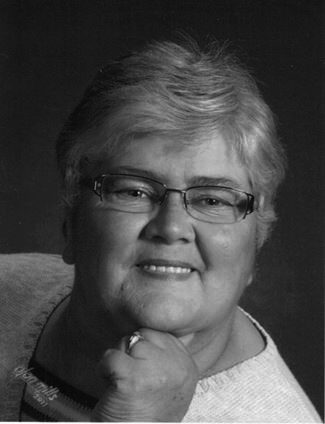 Elderly woman smiling with glasses