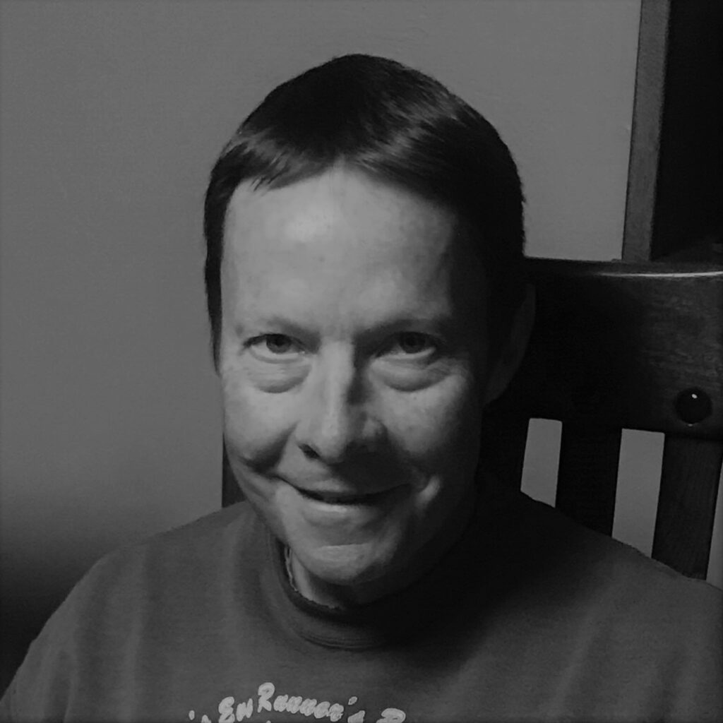 Black and white portrait of smiling person