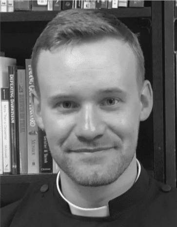 Portrait of smiling man wearing clerical collar
