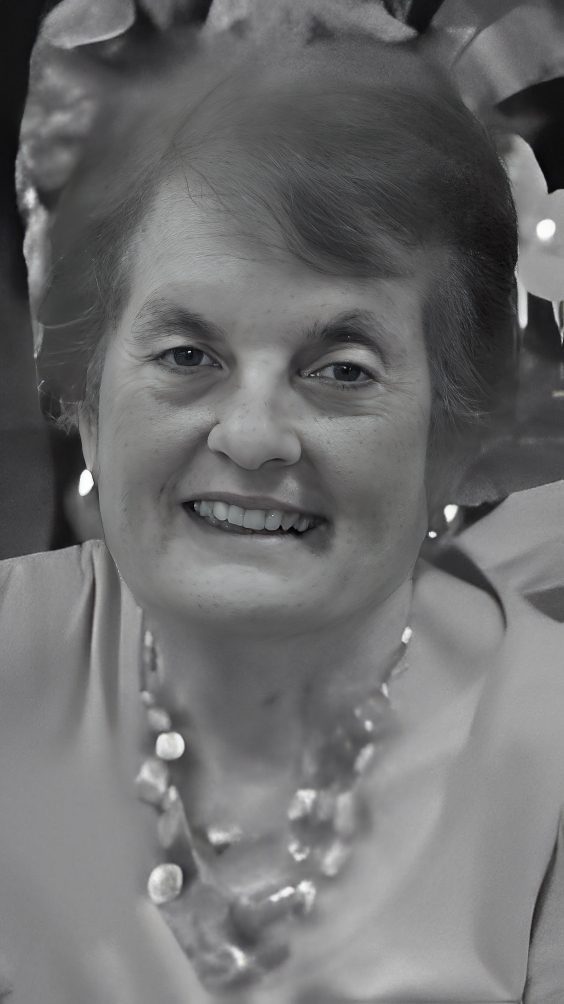 Smiling woman wearing beaded necklace