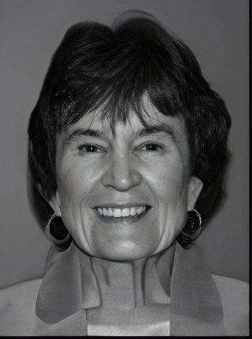Black-and-white portrait of a smiling woman