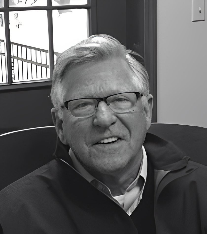 Smiling older man wearing glasses indoors