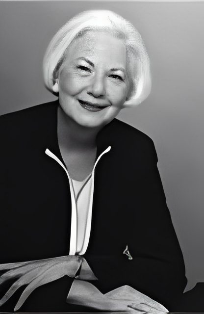 Smiling older woman with white hair