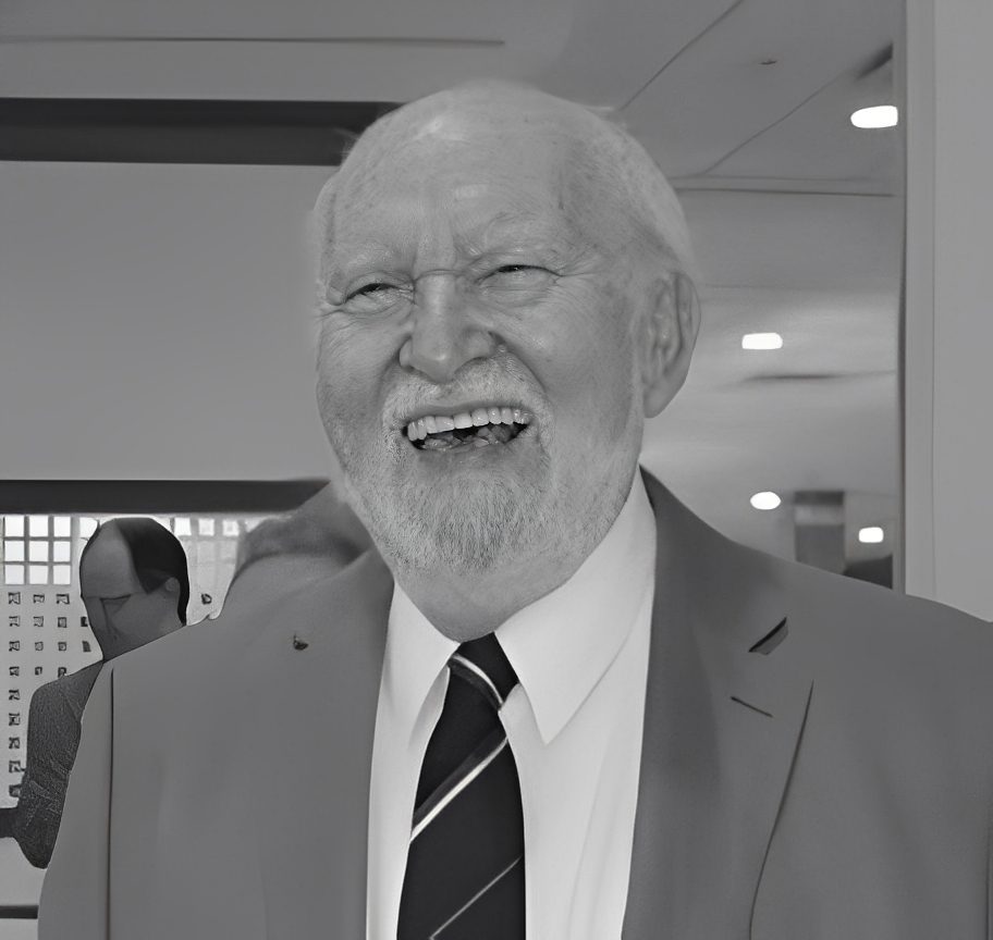 Smiling elderly man in suit and tie