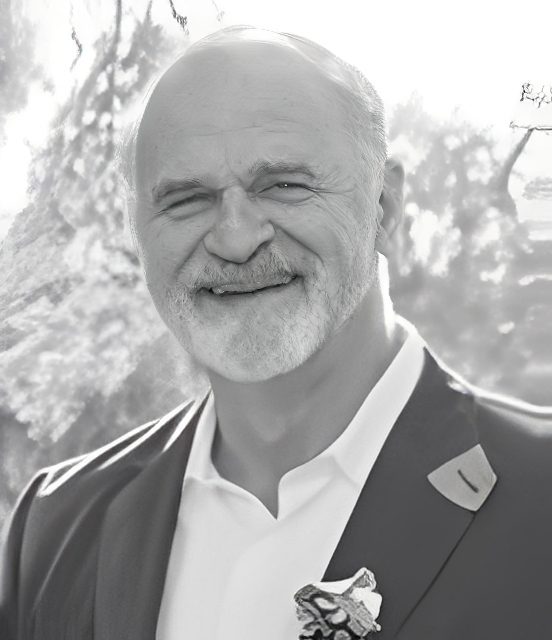 Smiling older man in suit outdoors