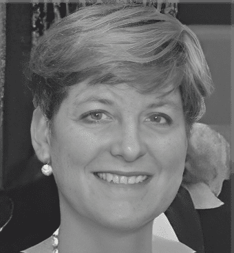 Smiling woman with short hair and earrings