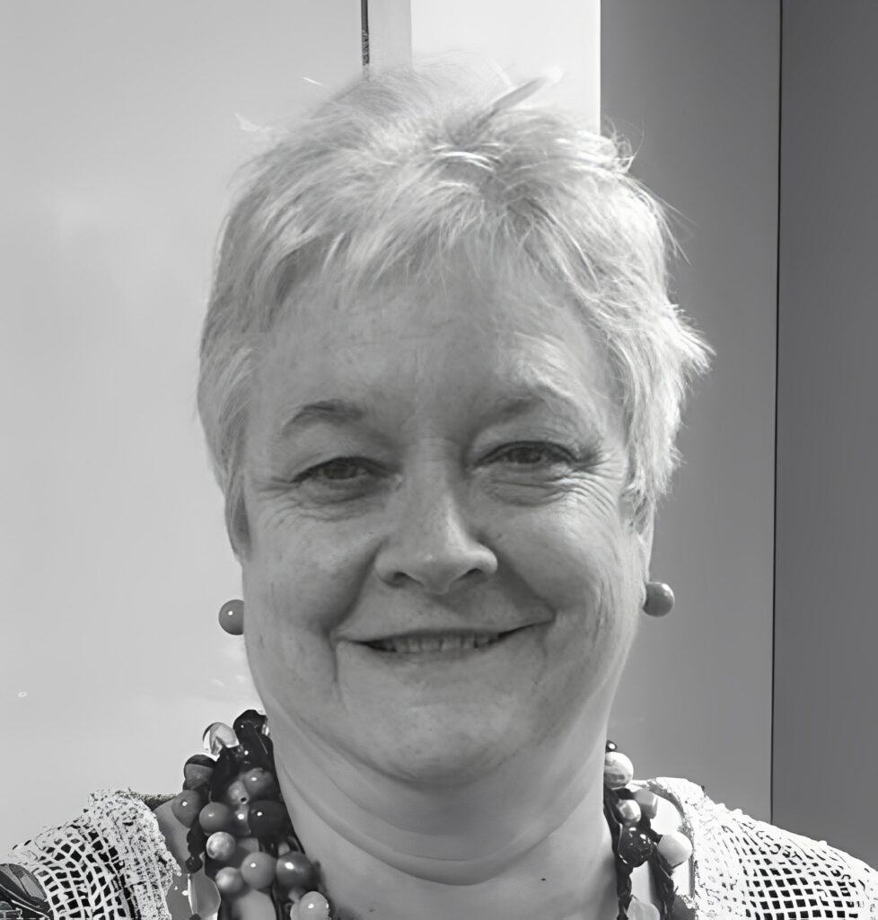 Smiling older woman wearing beaded necklace