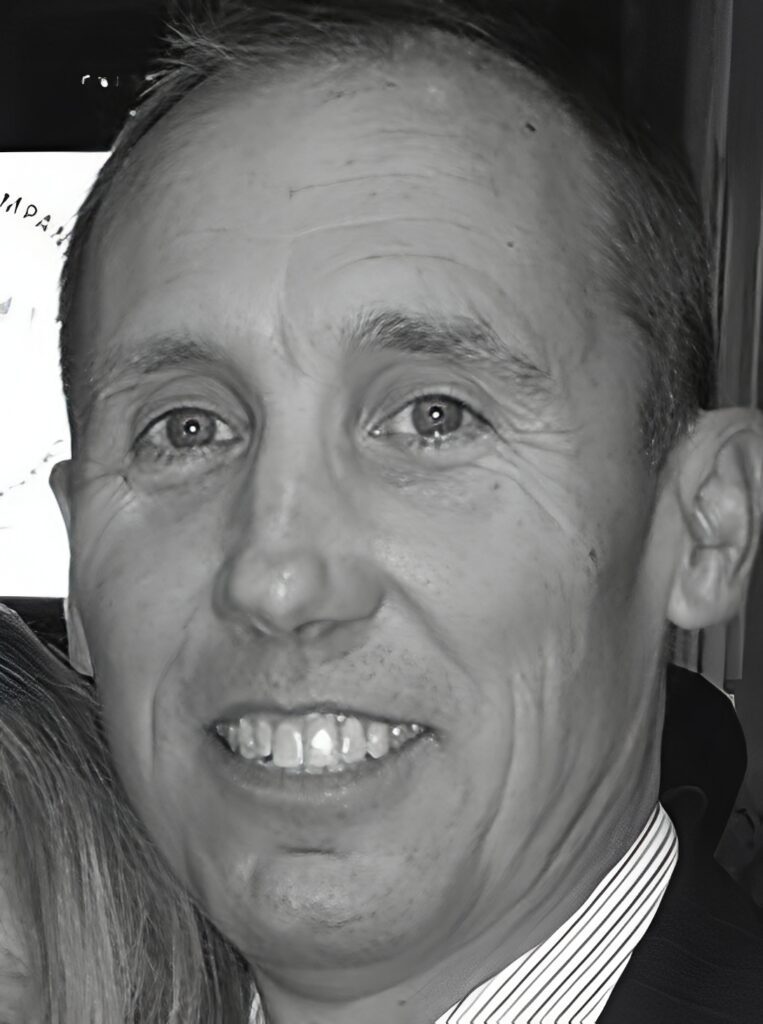 Close-up black-and-white smiling man portrait