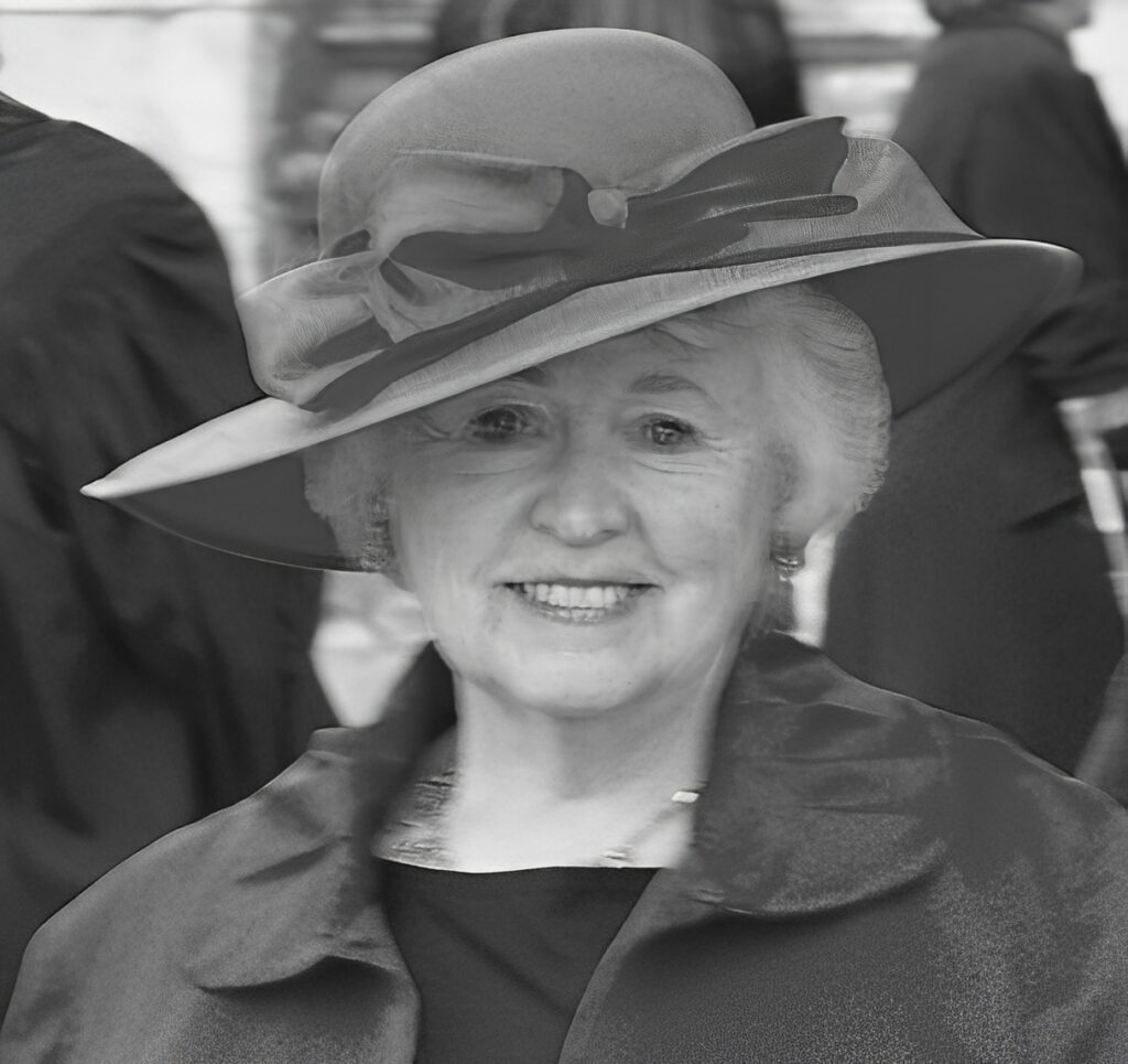 Smiling older woman wearing wide-brim hat