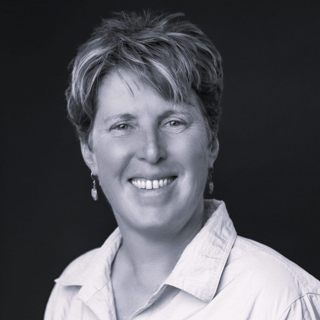 Grayscale portrait of smiling middle-aged woman
