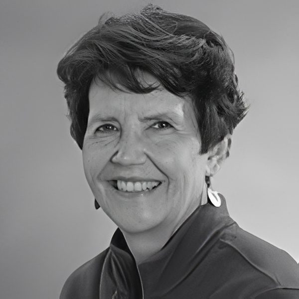 Black-and-white professional headshot of smiling woman