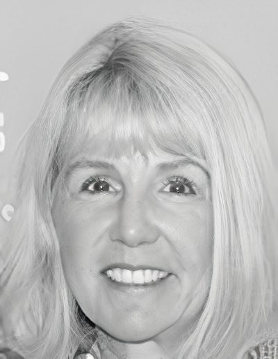 Smiling middle-aged woman with blonde hair