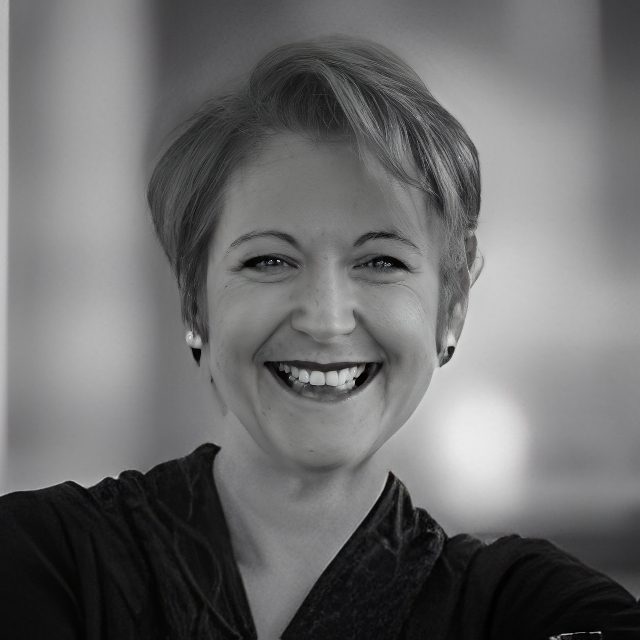 Black-and-white portrait of smiling woman