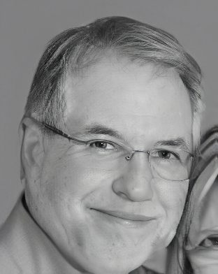 Smiling middle-aged man wearing glasses