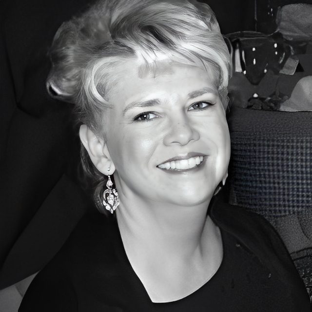 Black-and-white portrait of smiling woman
