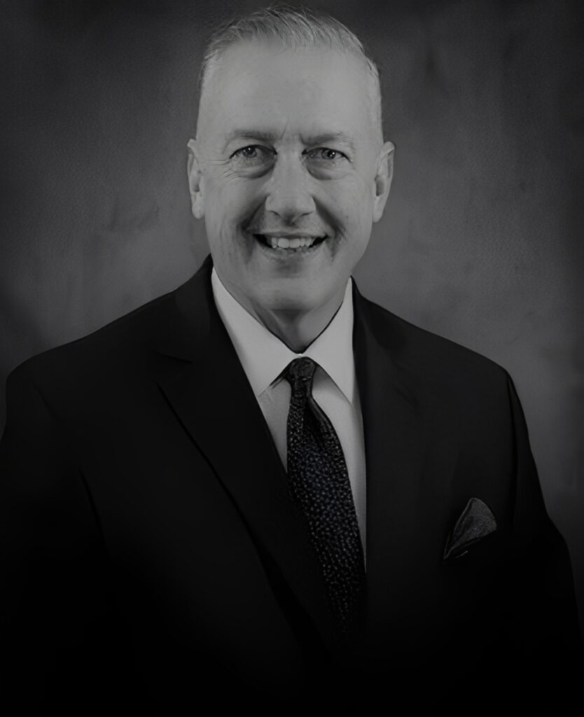 Smiling businessman headshot in suit and tie
