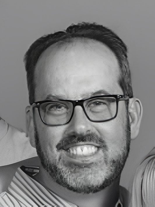 Smiling man with glasses and beard