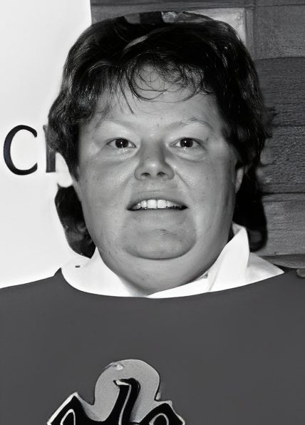 Close-up black-and-white portrait of smiling woman