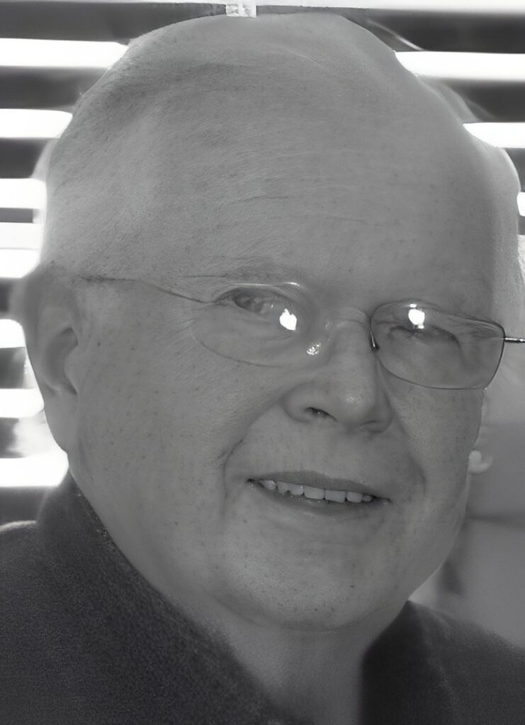Smiling bald man wearing glasses